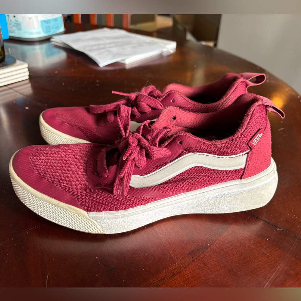 Women’s maroon Vans sneakers